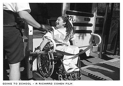 Ana in wheelchair on bus lift